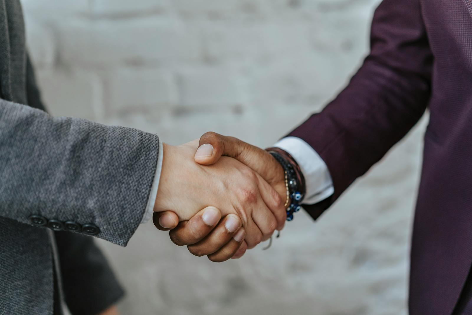Business partnership handshake